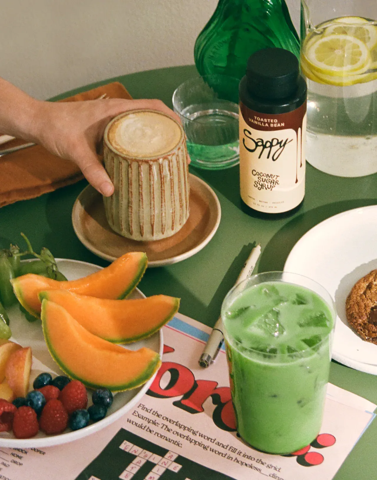 Breakfast table with matcha, coffee and fruit
