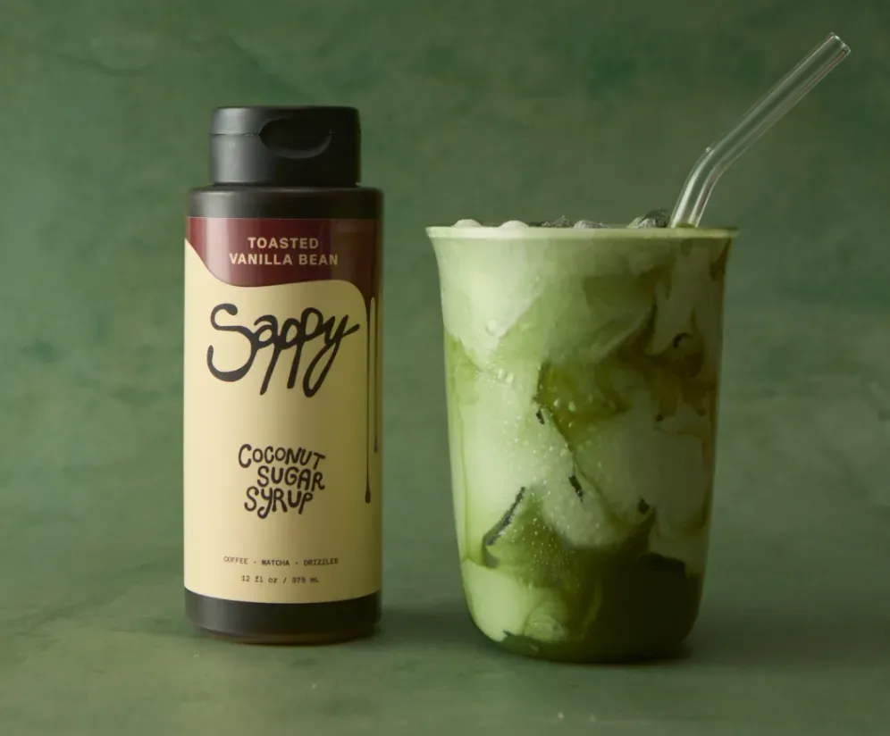 Sappy bottle beside an iced matcha latte