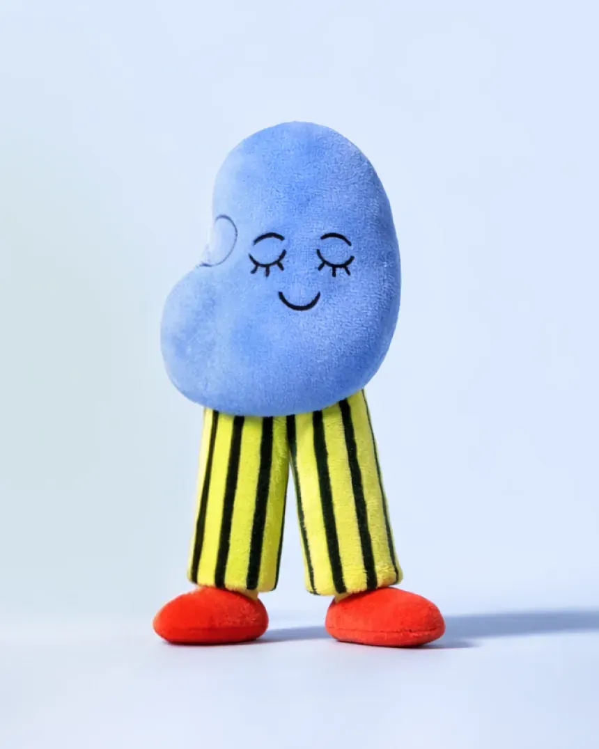 Nomie character Beanie as a plush figure