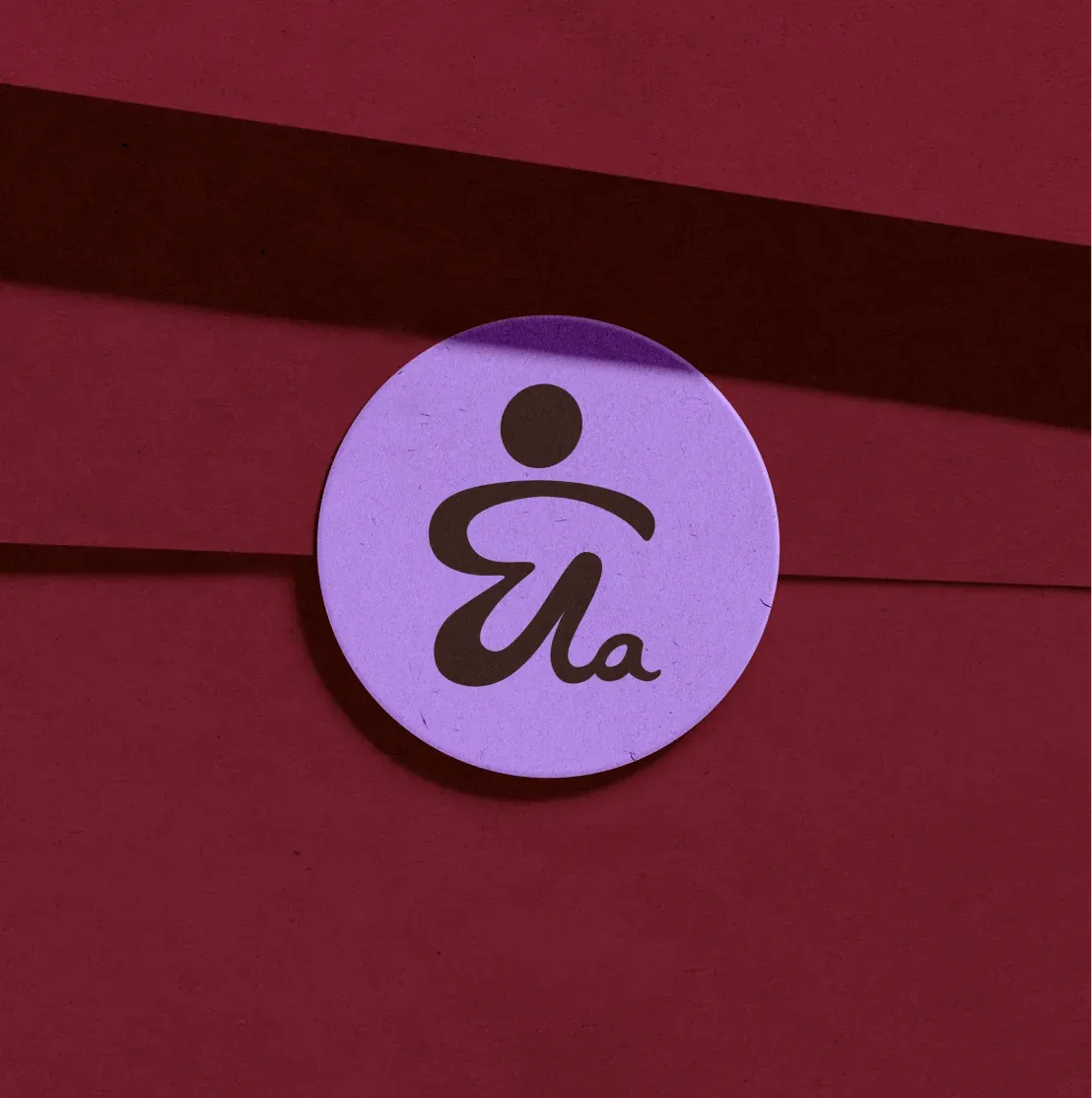 Purple ByEla sticker on a red background